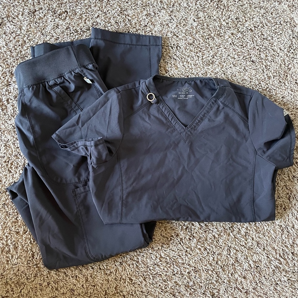 TWO scrub sets